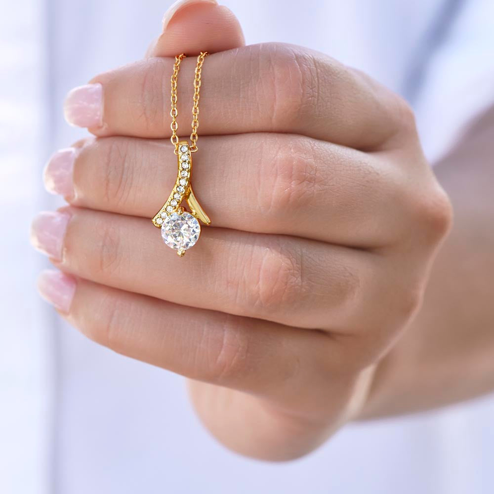 •	Alluring Beauty (No Message Card) Customized with up to 10 characters  •	14k white gold finish or 18k yellow gold finish over stainless steel •	7mm cubic zirconia  •	Pendant dimensions: 0.8" (20mm) height / 0.4" (10mm) width •	Adjustable length: 18" - 22" (45.72 cm - 55.88 cm) •	Lobster clasp •	MADE IN THE USA!
